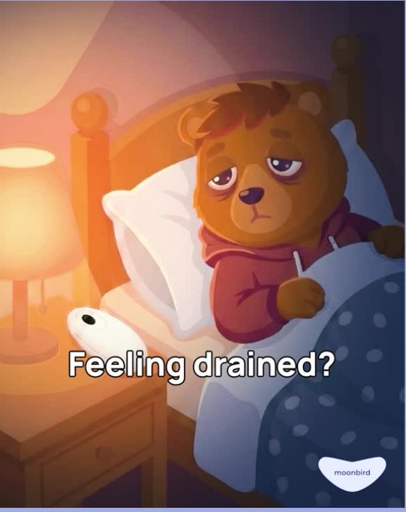 Illustrated animated frame of a tired bear in bed beside the Moonbird device with the caption Feeling drained?